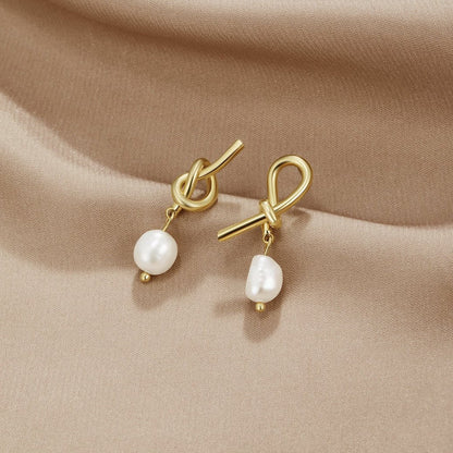 De Knotted Goud & Freshwater Pearl Oorbellen | Goud